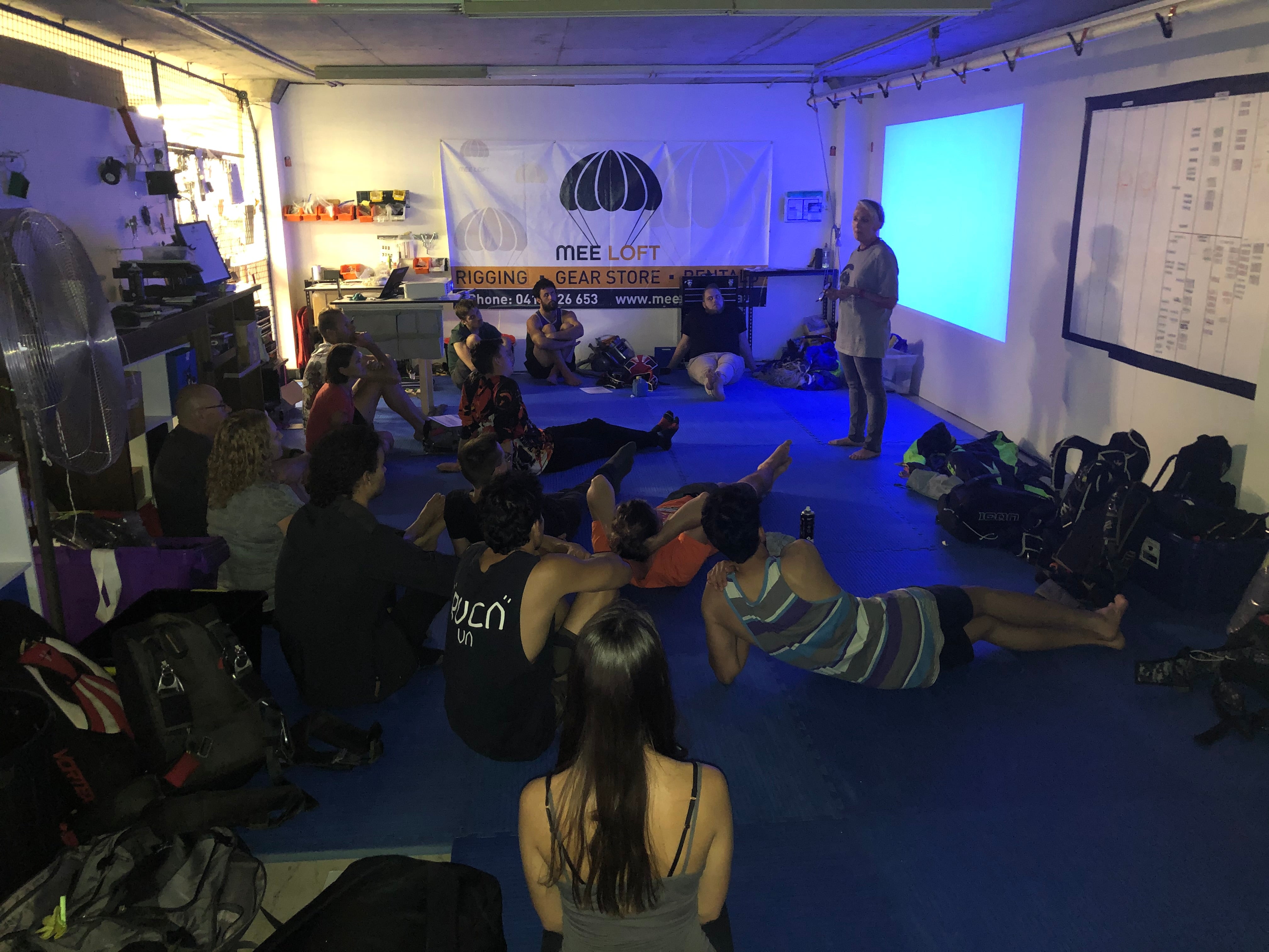 Skydivers listening to a gear education seminar at Mee Loft Monthly Maintenance
